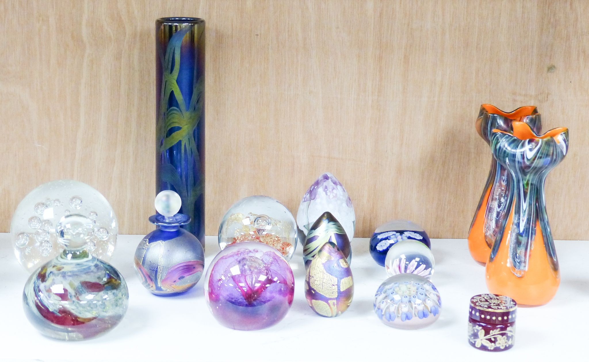 A group of 20th century glass paperweights and studio glass vases, Tallest 24 cm high